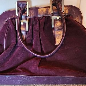 Woman's Suede Burgandy bag with purple trim. Gently used